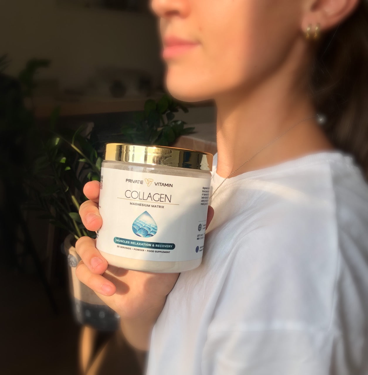 A woman showcases a premium collagen supplement designed to boost hydration and recovery. Ideal for supporting joint health, skin hydration, and overall wellness. Perfect for those seeking a natural solution for enhanced physical recovery and beauty from within.